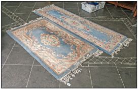 Two Chinese Embossed Decorated Rugs, predominantly light blue in colour. 60 by 36 inches and 84 by