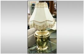 Large Gold Coloured Table Lamp with cream fringed lamp shade. 29 inches in height.