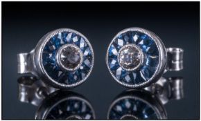 Art Deco Style 18ct White Gold Set Diamond And Sapphire Stud Earrings. The central round cut diamond