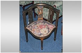 An Edwardian Black Lacquered Chinese Corner Chair, the central panel of a child flying on a kite.