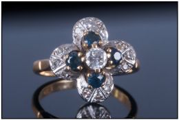 18ct Gold And Platinum Diamond And Sapphire Cluster Ring. Flower head setting, marked 18ct.