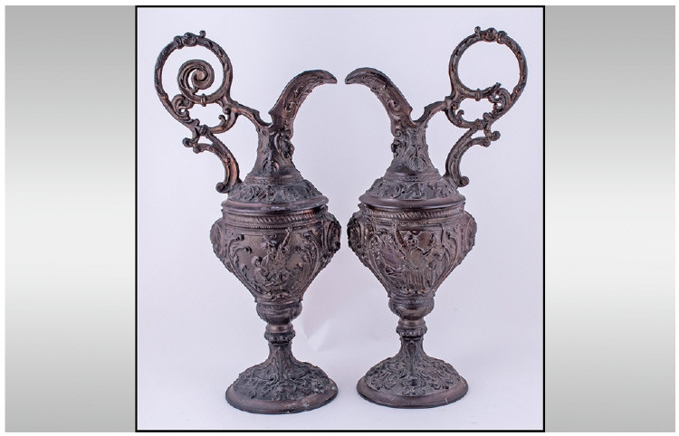 A Pair of French Nineteenth Century Bronzed Spelter Ewers, of classical form, with figures molded to
