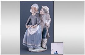 Lladro Figure 'Boy Meets Girl' model number 1188, Issued 1972-1989. 8.5" in height. Excellent