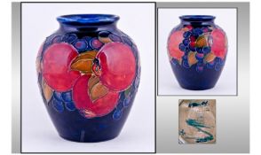 William Moorcroft Signed Vase. Pomegranates and berries pattern. Circa 1930s. Potters to the Queen