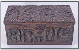 A Tin Embossed Cigarette Box, bronzed finish with wood lined interior, in the form of a Medieval