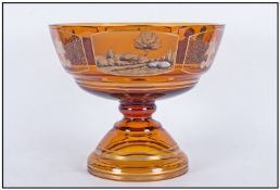 An Amber Glass Large Footed Bowl, finely gilded with three decorated cartouches. Depicting a