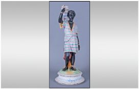 Early 20th Century Hand Painted Pottery Figure of a North African Male Water Carrier. Dressed In