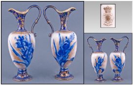 Pair of Doulton Burslem Small Ewers, the ovoid bodies decorated with blue floral representations,