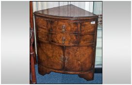 A Walnut Reproduction Miniature Corner Cupboard with two drawers above a cupboard below, in the