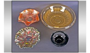 Two Glass Carnival Dishes. One in green lustre with grapevines, the other orange with acorn, wheat