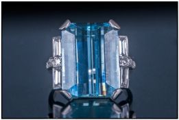 Art Deco Style White Gold Ring, set with a large step cut aquamarine set between four baguette and