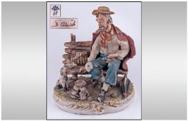 Capodimonte Early & Signed Figure 'Tramp On A Bench, Cooking Dogs Dinner' excellent condition. 12"