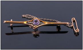 9ct Gold Bar Brooch. Set With A Round Central Amethyst. Fully Hallmarked.