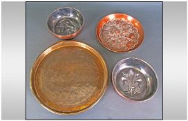 Two Copper Jelly Moulds, Indian Brass Engraved Tray, 13 inches in diameter, and a copper Indian