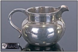 The Goldsmiths & Silversmiths Co Small Silver Jug Of Plain Form. Hallmark London 1912. Height 2