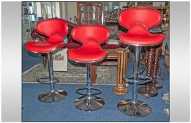 Three Modern Chrome and Red Kitchen Bar Stools.