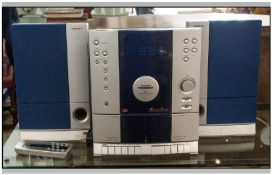 Tamashi CD Player with two speakers and remote.