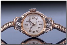 Ladies 9ct Gold Cocktail Watch. The watch has a 17 Jeweled Movement , A Numeral Dial, 2 Diamonds Set