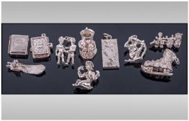 Collection Of 10 Miscellaneous Silver Charms. To include train, toby jug, ingot, etc.