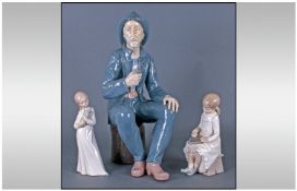 Three Nao by Lladro Figures comprising A Fisherman, of large size sitting down, smoking a pipe. 16