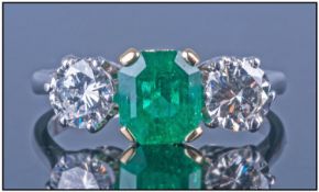 18ct White Gold Emerald And Diamond Ring, Set With a Central Columbian Emerald Between Two Round