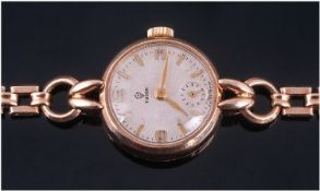 Rolex Tudor 9ct Gold Manual Wind Ladies Wristwatch fitted on a 9ct gold strap. Circa 1955. Fully