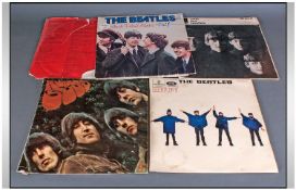 Five Beatle LP's comprising Rubber Soul, Rock n Roll Music Vol 1,Help, With The Beatles and Help.