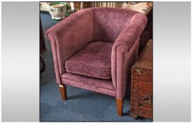 A Velour Purple Contemporary Covered Tub Chair with scrolling arms & square tapering legs.