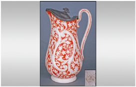 Staffordshire Parian Ware Pewter Lidded Jug with embossed floral decoration highlighted in orange,