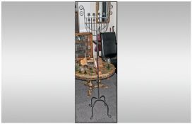 A Floor Standing Wrought Iron Candleabra with a lyre shaped top supporting 4 candle holders. 62