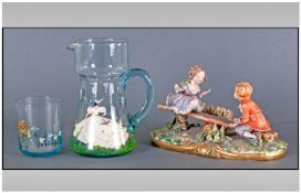 Capodimonte Group Figure Children On A Seesaw. Together with a 1930s glass decorated lemonade jug
