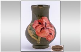 Moorcroft Small Vase, "Coral Hibiscus" design on green ground. Height 4.25 inches, excellent