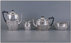 Late Victorian Four Piece Silver Tea Service, in the Classical style, engraved upper section,