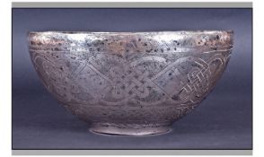 An Unusually Large Nigerian White Metal Bowl. The exterior decorated all over with traditional