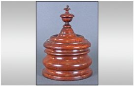 A Turned Treen Lidded Box Of Fine Quality Turning, with a finial top to body with a deep moulded