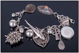 Ladies Silver Charm Bracelet. Loaded with 12 Silver Charms. Length 7 inches.