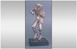 An Early To Mid 20th Century Silver Figure Of a Man Dressed In Polish/Russian Dress Playing At A