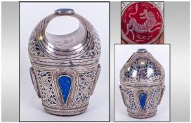 A Middle Eastern Silvered Metal Desk Seal, of unusual form. A Cornelian engraved seal to the base,