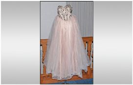 Ladies Prom Dress, as new condition. Size 6. Nude colour. Corset back & detailed bodice with studded