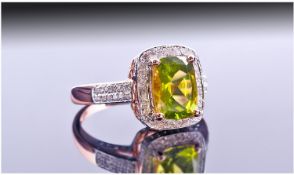 14ct Rose Gold Set Peridot And Diamond Ring. The cushion cut peridot surrounded by diamonds. Also