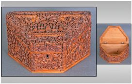 A Good Quality Carved Sandlewood Indian Angular Shaped Writing Box,the interior missing, carved