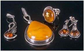 Collection Of Amber Set Silver Jewellery. Comprising 2 pendants, fashion ring, and a pair of