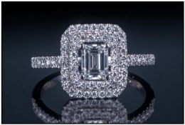 White Gold Diamond Dress Ring. Set with central emerald cut diamond surrounded by round modern