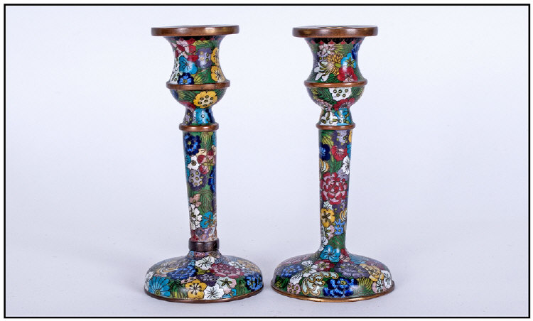 Cloisonne Pair Of Candlesticks. Circa 1920s. Each candlestick stands 6 inches high.