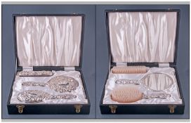 A Silver Backed Good Quality Embossed Ladies 4 Piece Vanity Set. Comprising hand mirror, brush, hand