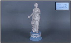 Wedgwood Figure Of A Classical Dressed Lady Holding A Bunch Of Flowers To Each Hand & raised on a