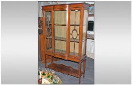 Edwardian Inlaid Mahogany Display Cabinet with a serpentine shaped glass to the centre with astral