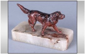 Cold Painted Figure Realistically Modelled as a Dog, on an onyx base.