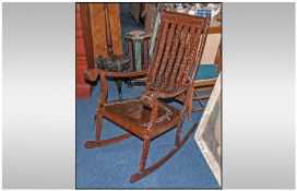 Inlaid Rosewood Indian Carved Rocking Chair. Slats, arms and seats inlaid with brass.