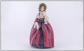 Royal Doulton Early Figure "Margery" HN 1413. Maroon and purple colour way. Issued 1930-1949.